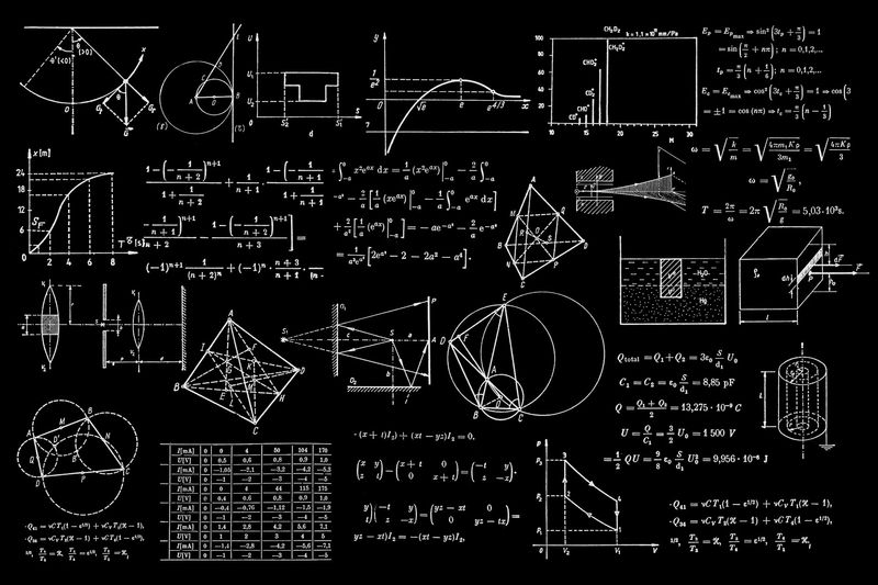 Formulas and diagrams chalked on a dark blackboard
